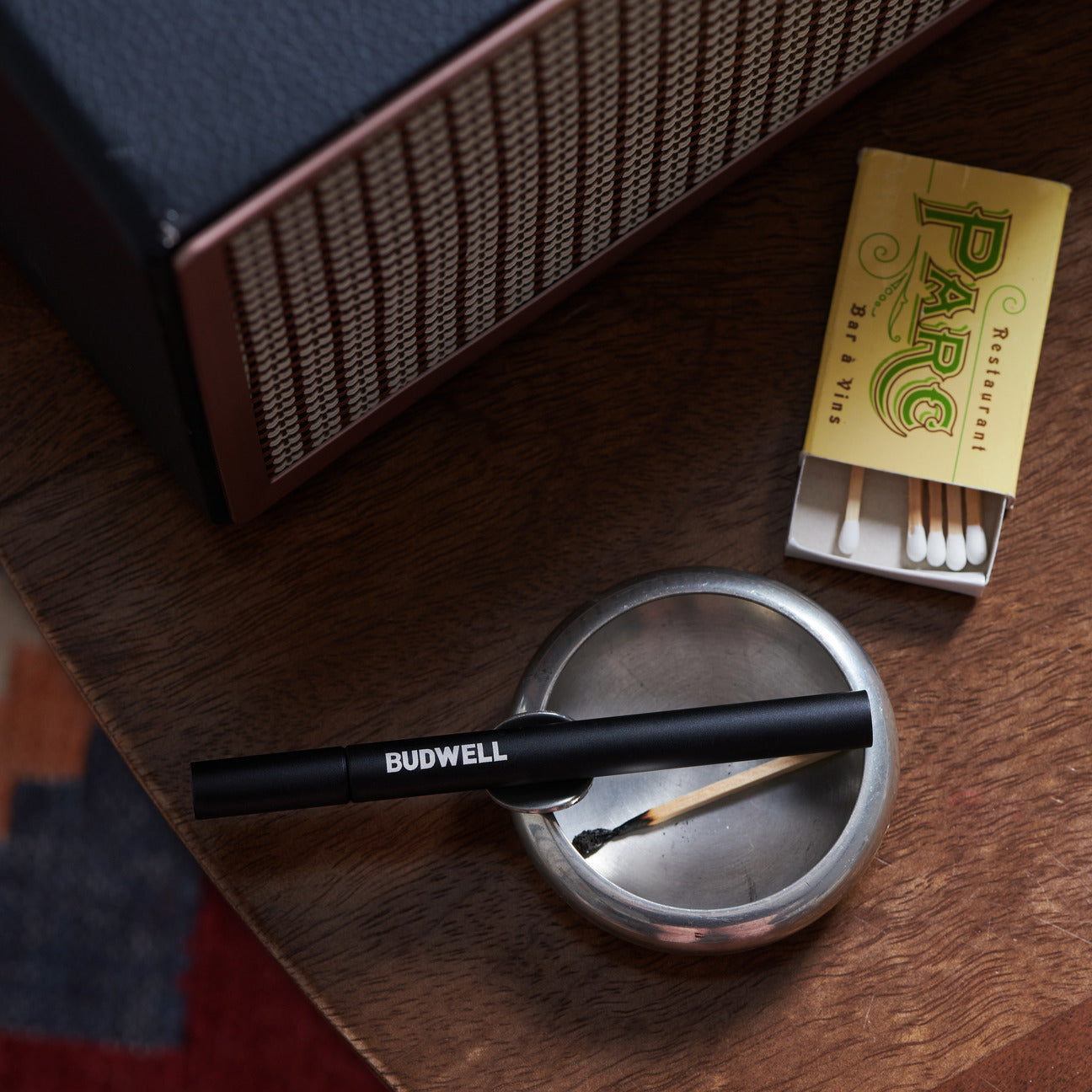 metal one hitter pipe with matches and ashtray