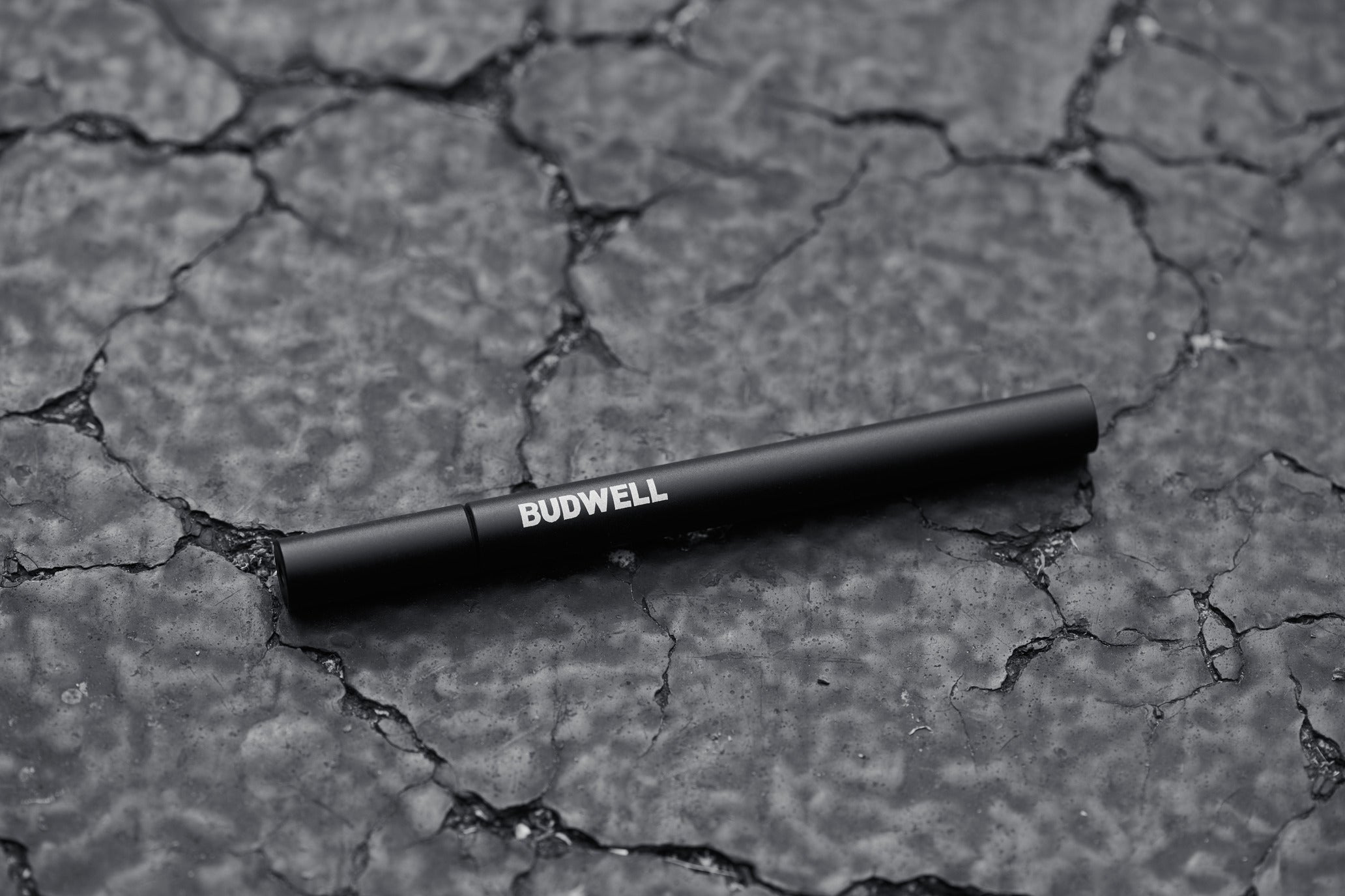 one hitter pipe laying on concrete