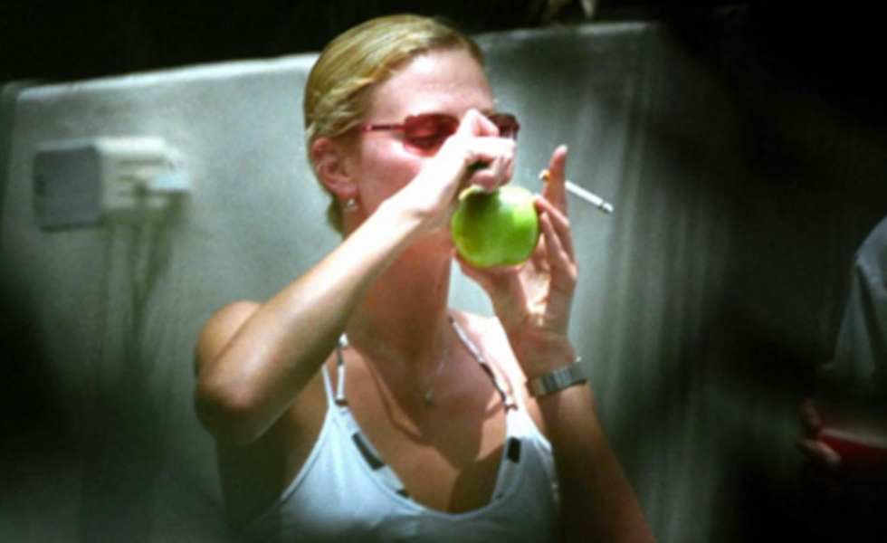 charlize theron smoking out of an apple